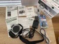 Canon EOS 300D Digital Camera body, battery pack, neck strap, user guides