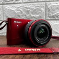 Nikon 1 J1 Crimson with accessories 