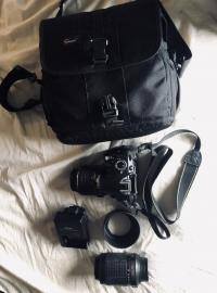 Nikon D3100 with two lenses and battery charger