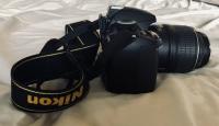 Nikon D3100 with two lenses and battery charger
